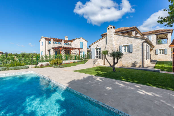 istock Luxurious beautiful modern villa with swimming pool and yard garden 1351926812