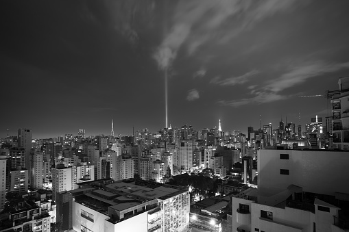 Night view of the Jardins de Sao Paulo district and the transmission towers on Avenida Paulista in the background.