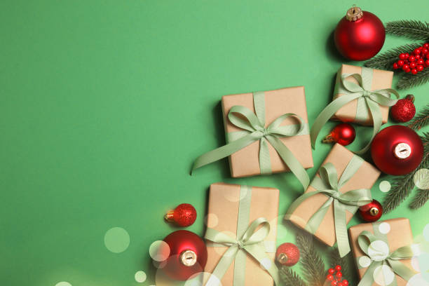 istock Christmas decorations and gifts on a colored background top view 1351928133