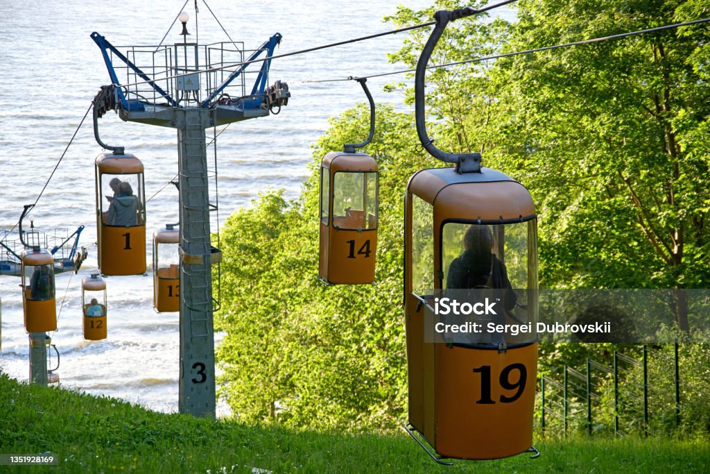 Cable car lift for tourists to beach of Baltic Sea in Svetlogorsk  resort town Cable car lift for tourists to beach of Baltic Sea in Svetlogorsk  resort town (until 1947 Rauschen). View to the mountainside with trees and sea, back light Svetlogorsk - Kaliningrad Oblast Stock Photo
