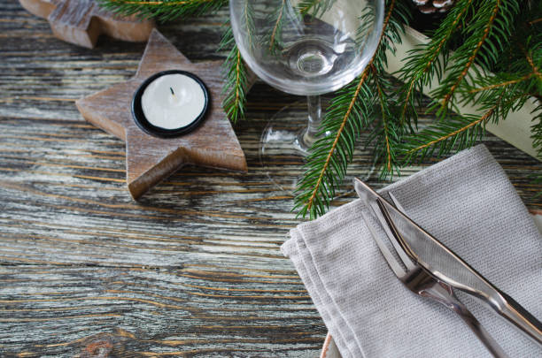 istock Christmas table setting with candles and fir branches 1351928172