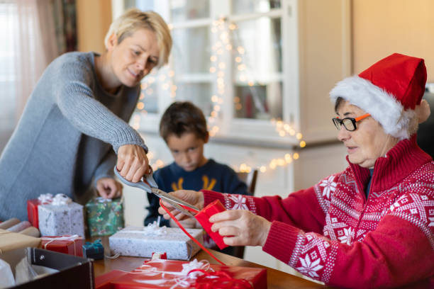 istock Helping each other with Christmas wrapping 1351935204