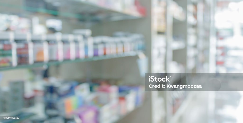 pharmacy drugstore shelves interior blurred abstract background Pharmacy Stock Photo