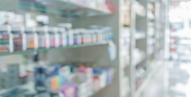 pharmacy drugstore shelves interior blurred abstract background pharmacy drugstore shelves interior blurred abstract background healthcare and medicine business hospital variation stock pictures, royalty-free photos & images