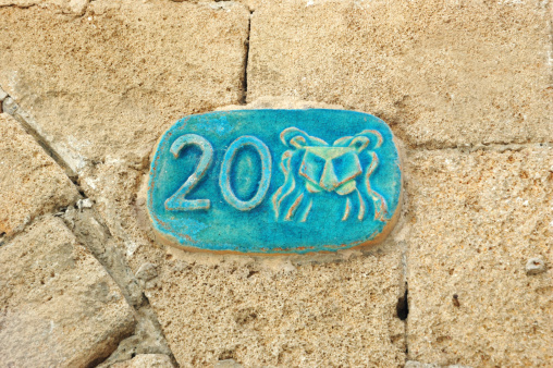 Old street plate with Lion zodiac sign, Jaffa, Israel
