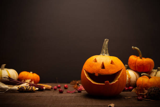 istock Jack-o-lantern pumpkin on a black background with copy space. Spooki happy halloween concept. 1351941542
