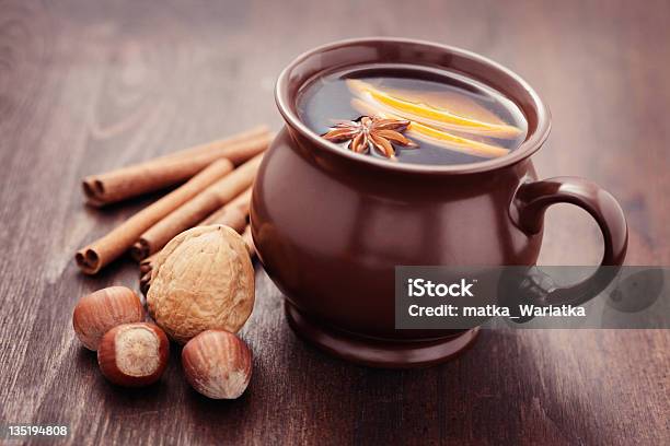 A Mug Of Hot Cider With Nuts And Cinnamon Sticks Stock Photo - Download Image Now - Alcohol - Drink, Cinnamon, Glögg