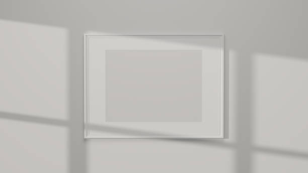 istock Modern white poster frame mockup on white walls with daylight 1351951955