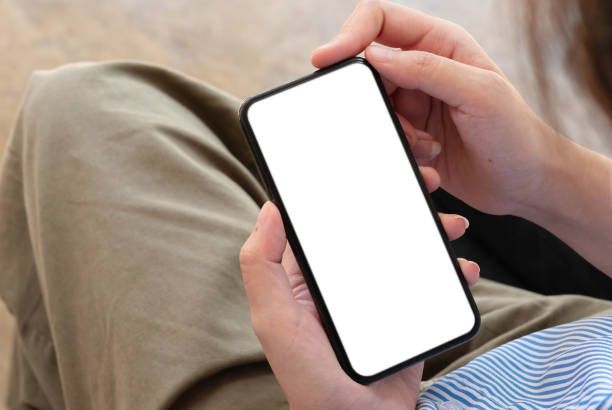 istock woman using Smartphone. Blank screen mobile phone for graphic display montage.networking service. 1351952674