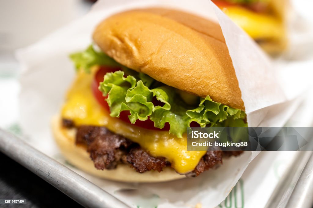 cheese burger at the restaurant cheese burger at the restaurant in Manila, Philippines Cheeseburger Stock Photo