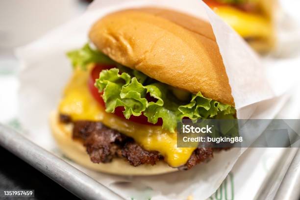 Cheese Burger At The Restaurant Stock Photo - Download Image Now - Cheeseburger, Restaurant, Beef