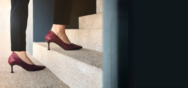 istock Motivation and Challenging Concepts. Woman Power. Steps Forward into a Success 1351959214