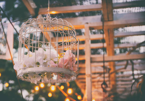 Outdoor birdcage with floral decoration