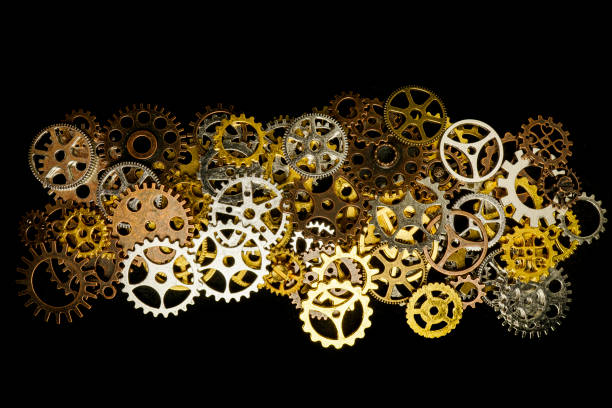 istock Cogs and watch pieces on black background metal wheels 1351960806