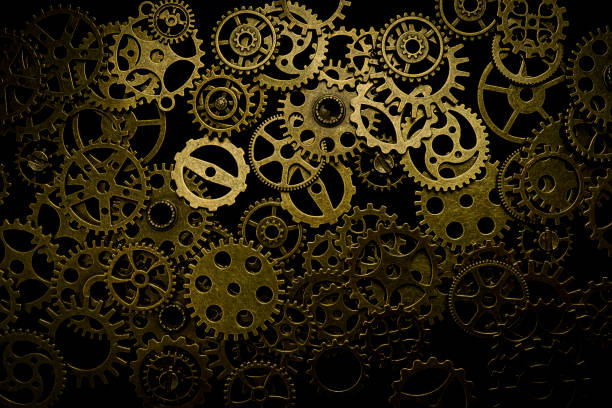 istock Cogs and watch pieces on black background metal wheels 1351960867