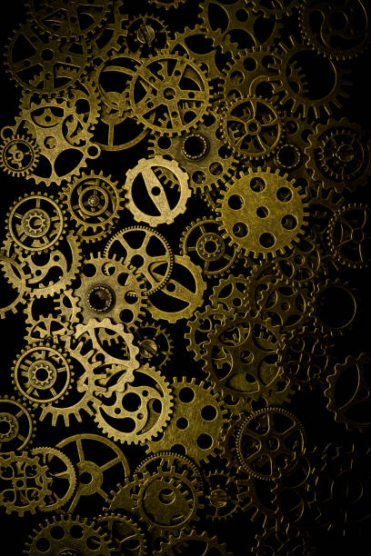 istock Cogs and watch pieces on black background metal wheels 1351960880