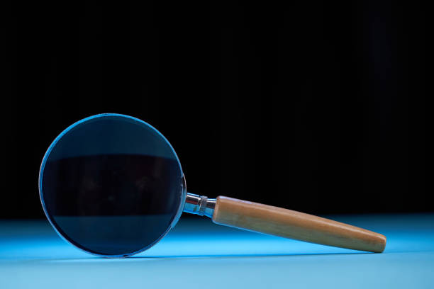 magnifying glass against black background