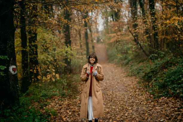 istock Walking through the fallen golden leaves 1351963959