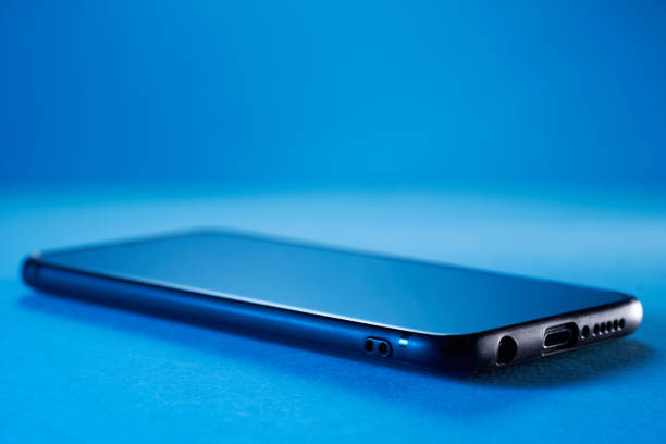 Mobile phone with bag on white background