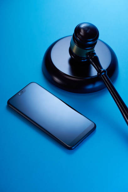 istock gavel hammer  with smartphone on blue background. Justice and law concept. 1351965006