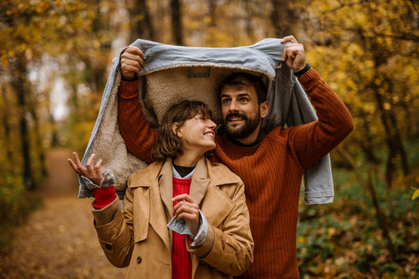 istock Come, I'll keep you away from the rain 1351965403