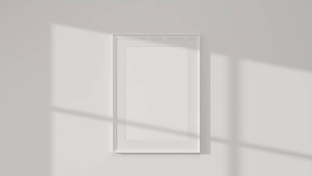 istock Simple white picture photo poster frame mockup on white wall 1351966214