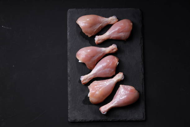 istock Raw chicken drum stick or leg pieces 1351966469
