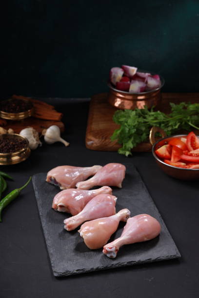 istock Raw chicken drum stick or leg pieces 1351966473