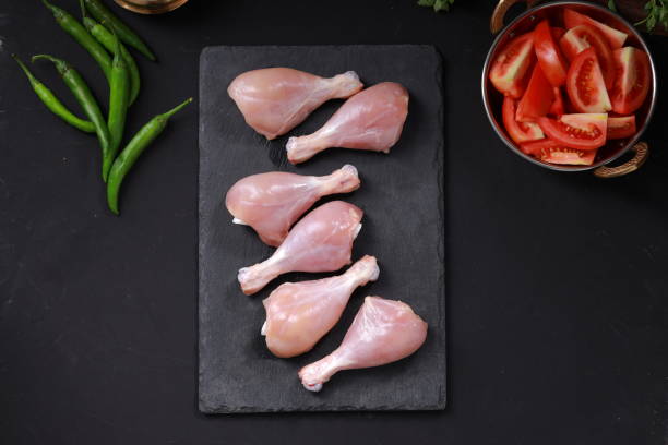 istock Raw chicken drum stick or leg pieces 1351966493