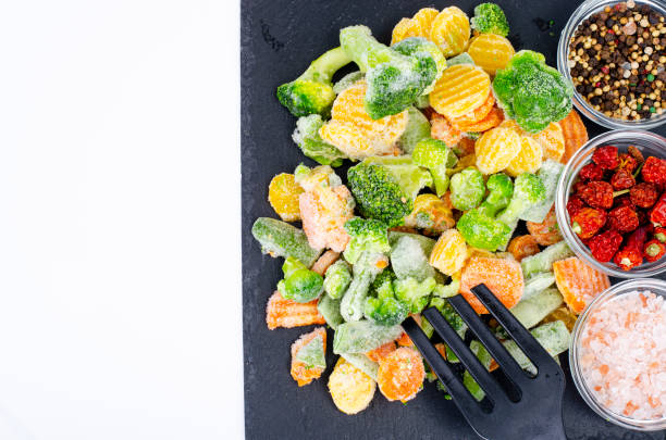 istock Mix of frozen vegetables on black. Studio Photo. 1351966897