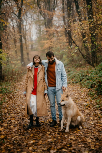 istock Young family walking with a dog 1351968263