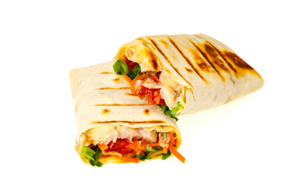 istock Homemade lavash, shawarma with vegetables, chicken. Studio Photo 1351968565