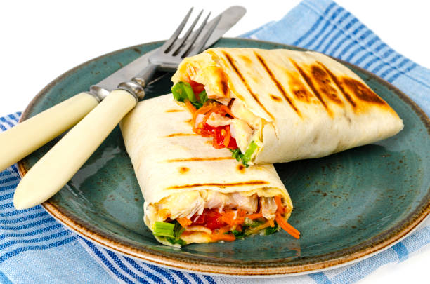 istock Homemade lavash, shawarma with vegetables, chicken. Studio Photo 1351968575