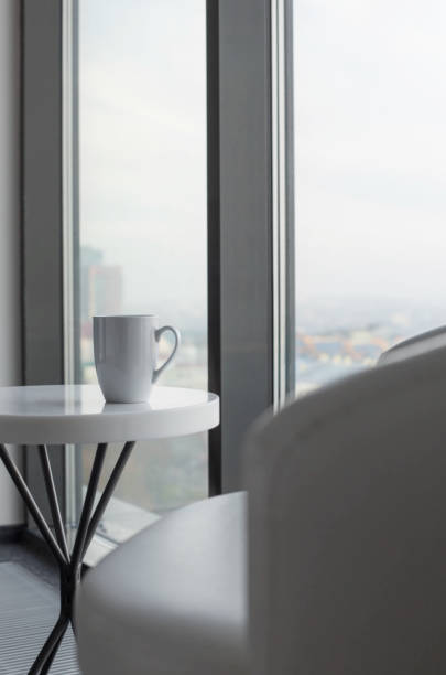 istock cup of tea on white table near  window 1351968829