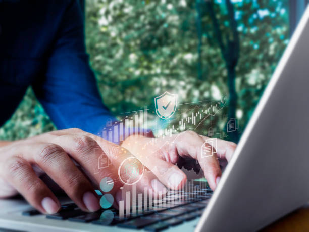 istock Virtual icon, safety shield, fingerprint, chart, graph from laptop while businessman's hand working, using keyboard computer. Cyber security data protection with business technology privacy concept. 1351977836