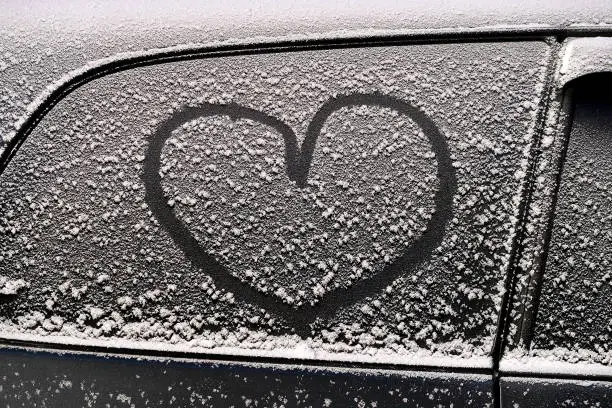 Heart Shape on the Snow of the Car Door