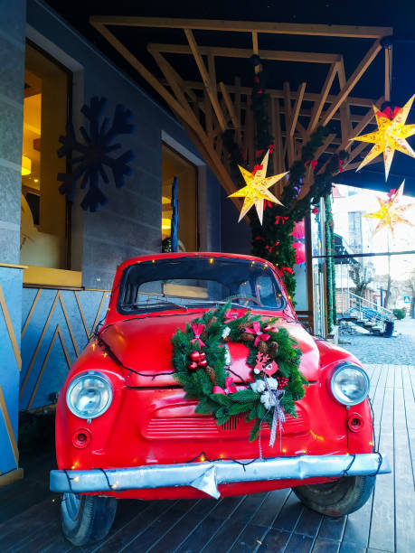 istock Red car with Christmas decoration 1351980969