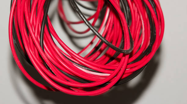 istock Red and black mixed wire network cable isolated on white background. 1351983486