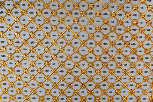 front view close up of Islamic ottoman era embossed golden ornament decoration in Topkapi Palace museum Istanbul