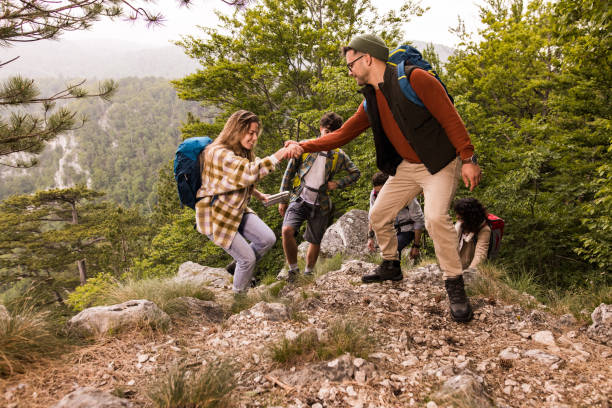 istock Come on, I will help you to climb this rocky mountain! 1351985327