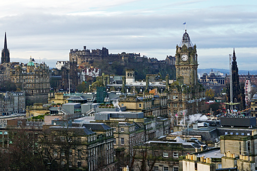 Sunset over Edinburgh from Calton Hill with old monument