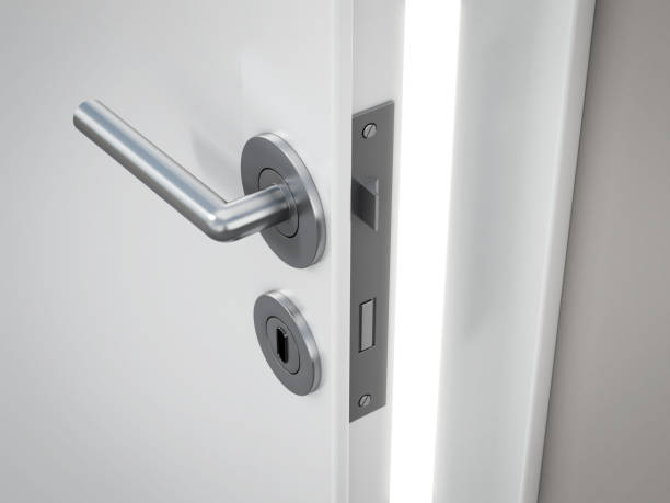 istock Half open house interior door with light coming from behind 1351990586