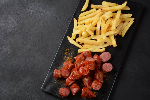 istock Traditional German currywurst  sausages with Curry spice 1351991869