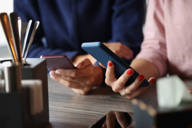 istock People hold mobile phones in hands 1351991946