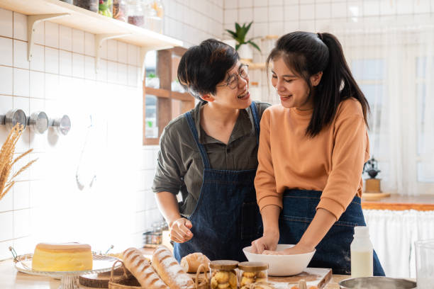 istock LGBT couple is preparing dough for cooking  in their kitchen 1351995323
