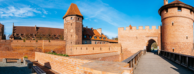 Malbork - The Castle of the Teutonic Order in a sunny autumn day. Blue sky on the background.