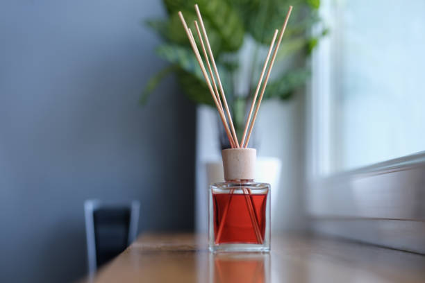istock Diffuser with wooden sticks on the windowsill, close-up 1351996435