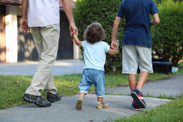 istock Young family on a walk 1351997785