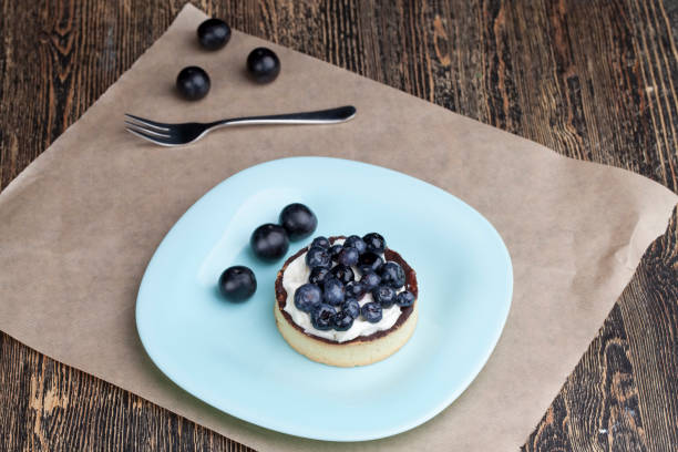 istock tartlet with chocolate and buttercream with blueberries 1352001387