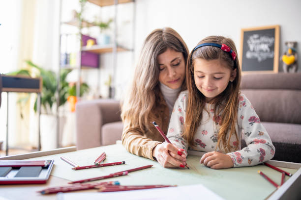 istock Mother learning her daughter to be artist. 1352002425